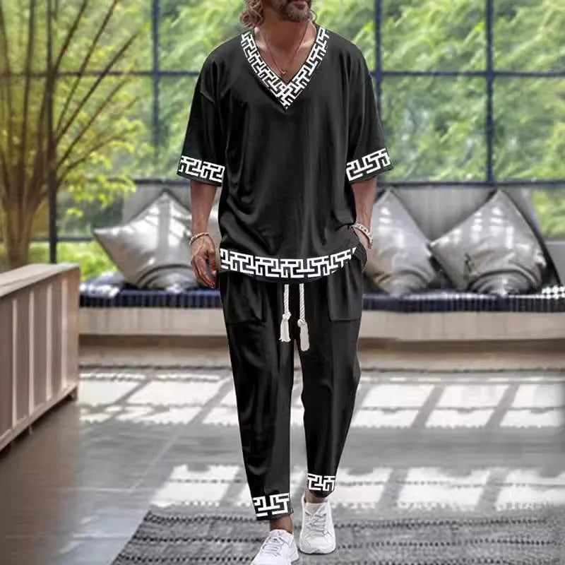 Lightweight polyester V-neck suit set with cropped sleeves and matching trousers on a hanger.