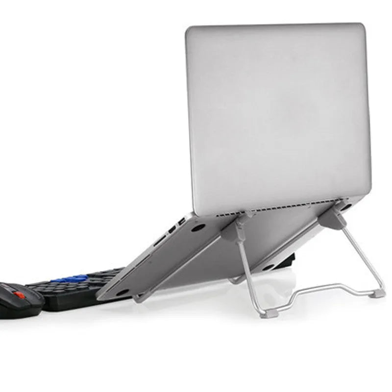 Grey aluminium alloy and plastic 0-type stand holding a mobile phone on a desk.