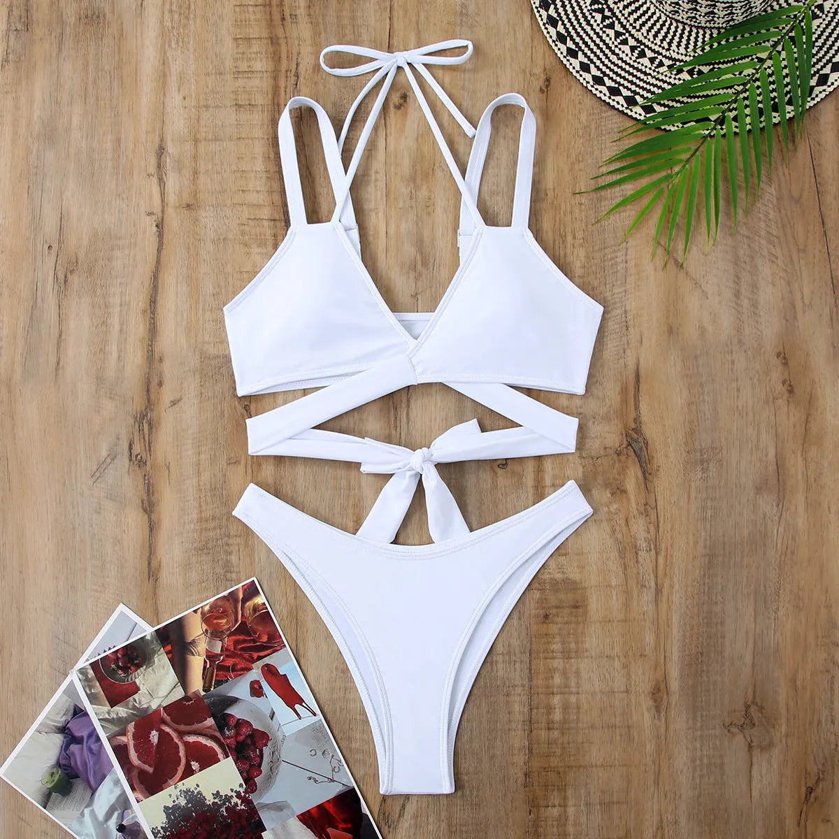 Women's solid colour brief bikini swimsuit on a hanger, showing sleeveless design.