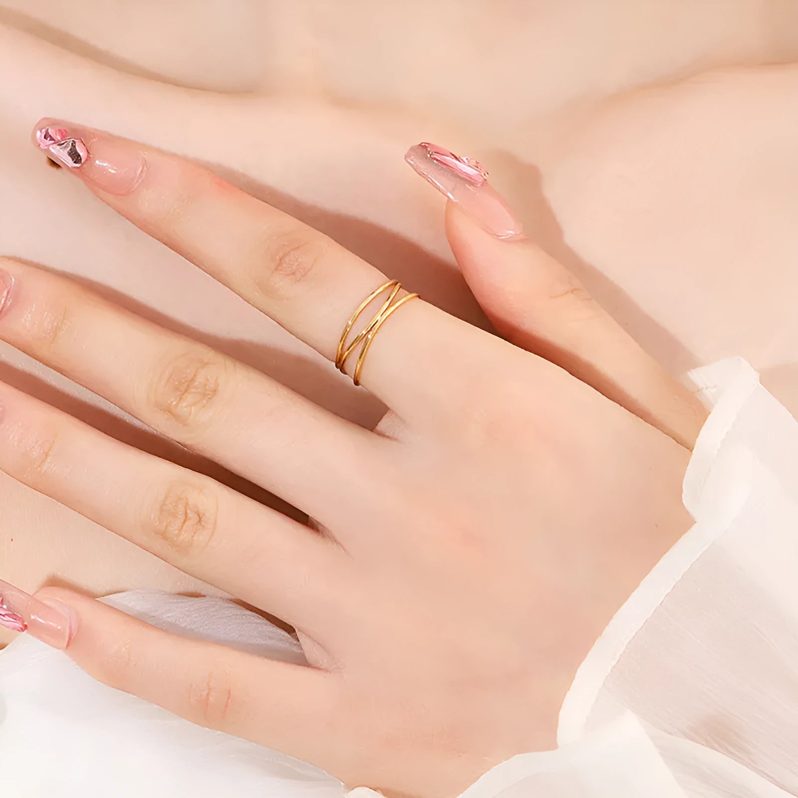 Gold titanium steel geometric ring with three-layer coil design shown from multiple angles
