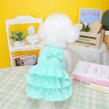 Small dog wearing princess dress with layered skirt design in candy colour option