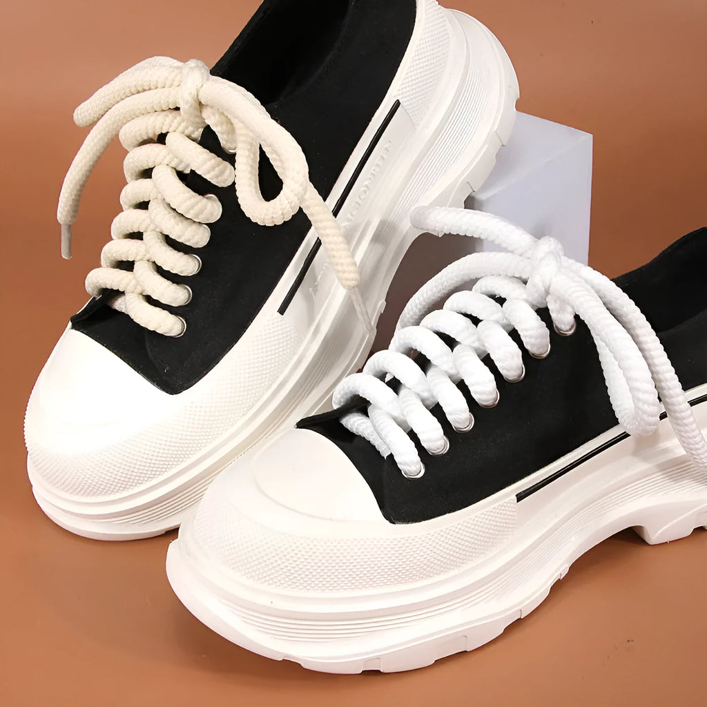 Round woven shoelaces for Bread Shoes in white, beige and black colours on a white background.