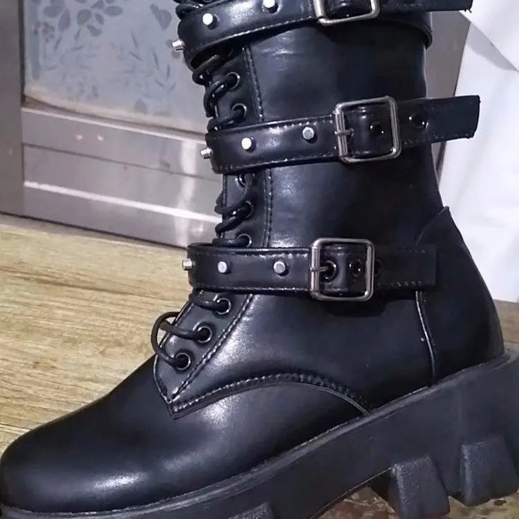 Women's black mid-calf knight boots featuring a metal buckle strap and a side zip closure.