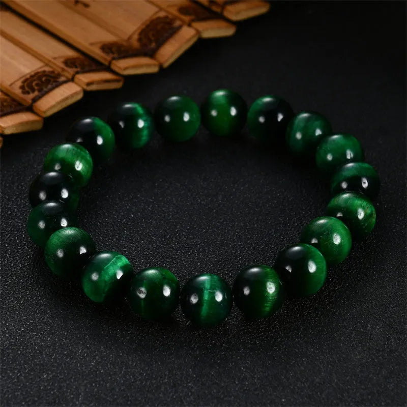 Green tiger eye stone bracelet with geometric beads in polished finish