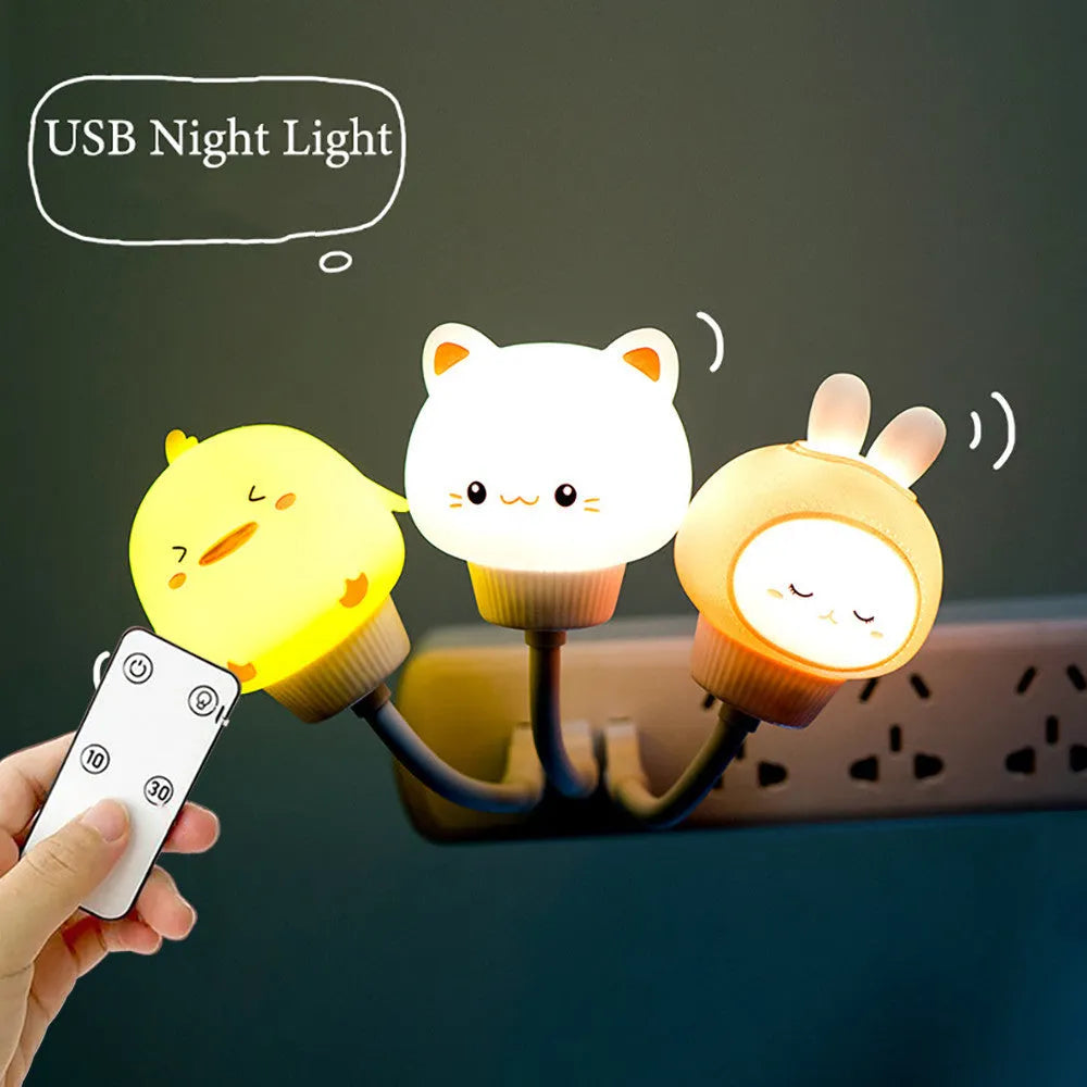 White cartoon bear-shaped USB night light with remote control on a wooden table.