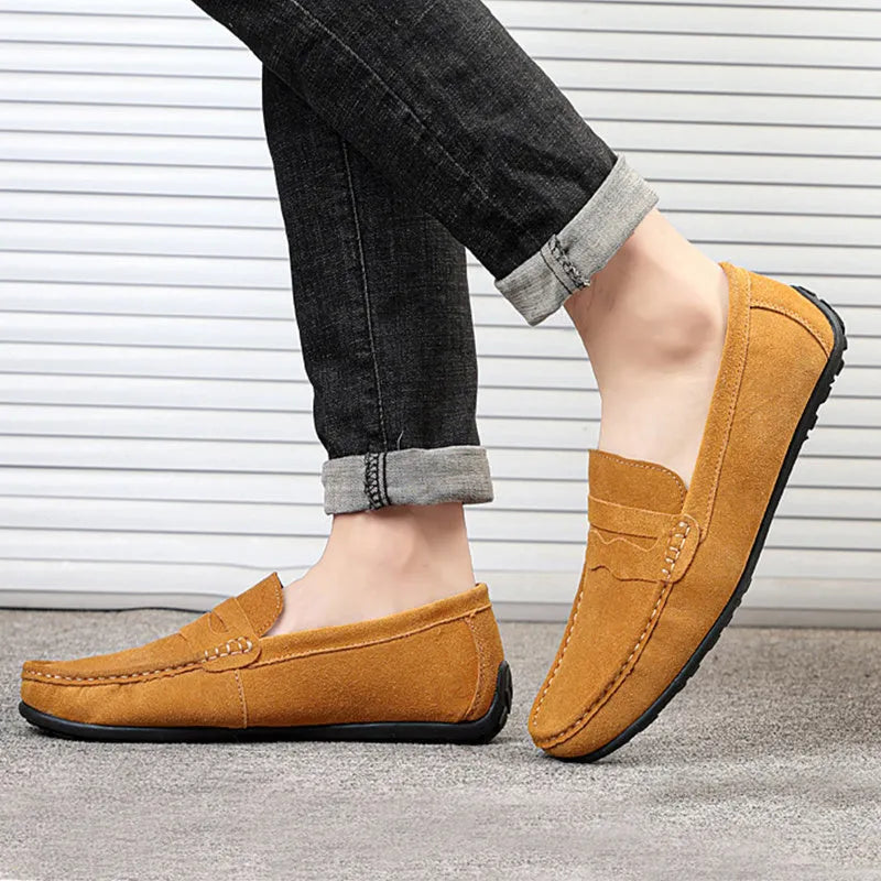 Men's brown suede loafers with round toe and flat rubber sole