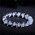 Women's white crystal ghost pyramid bracelet with Ruyi design element showing multiple purity size options