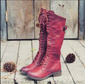 Women's black chunky heel high leg ankle boots with a round toe and low rubber sole.