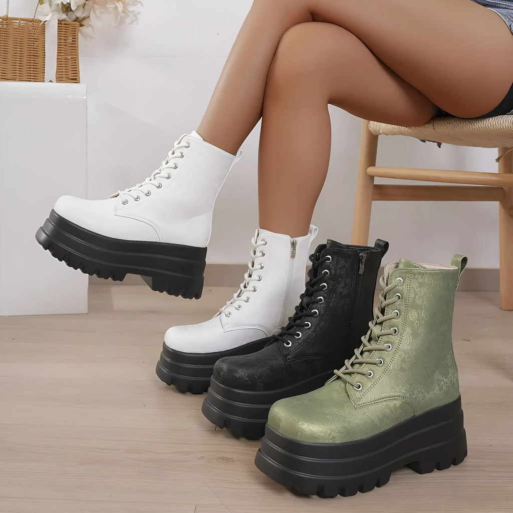 Women's white retro platform Martin boots with a chunky heel and side zipper on a neutral background.