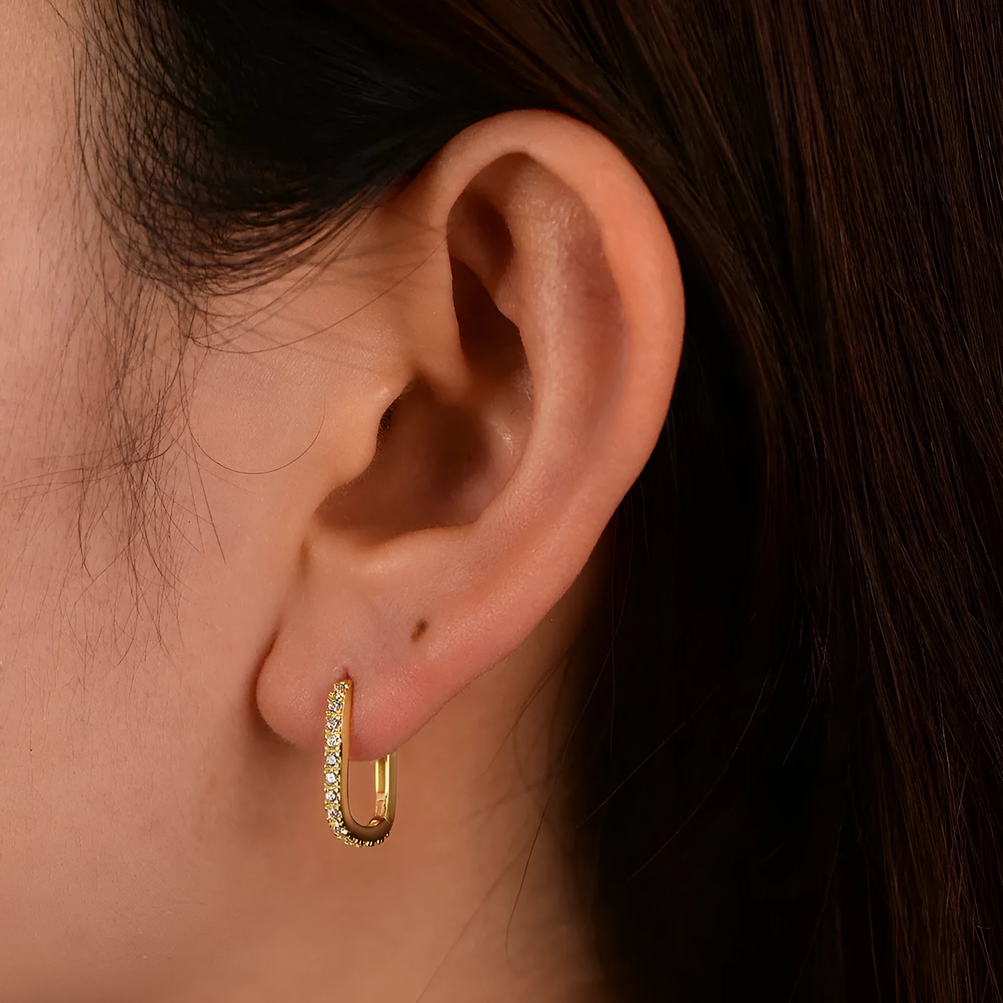 Sterling silver clip-on earrings with oval zircon stone in geometric design