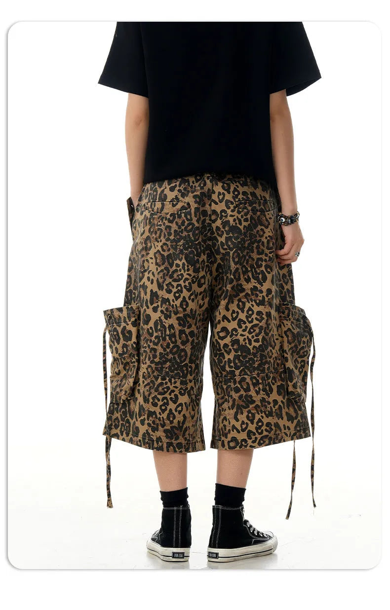 Leopard print high-waisted loose-fit cropped cotton trousers on a hanger