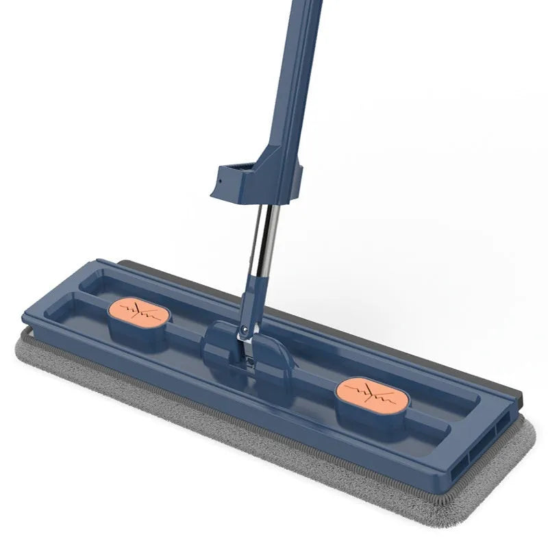 Large blue and white flat mop with a long stainless steel handle and a 360-degree rotating head on a hard floor.
