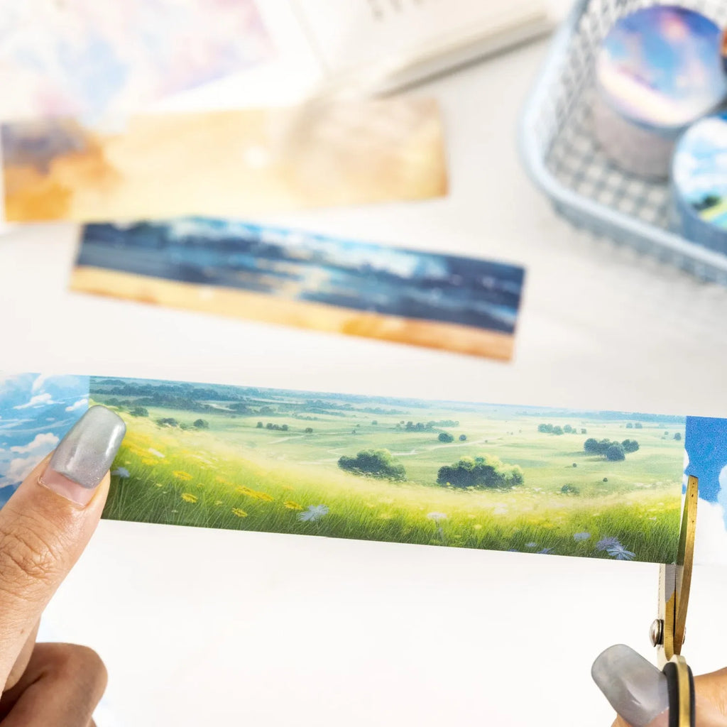 Japanese paper washi tape roll with celestial sky designs including twilight and colourful clouds patterns