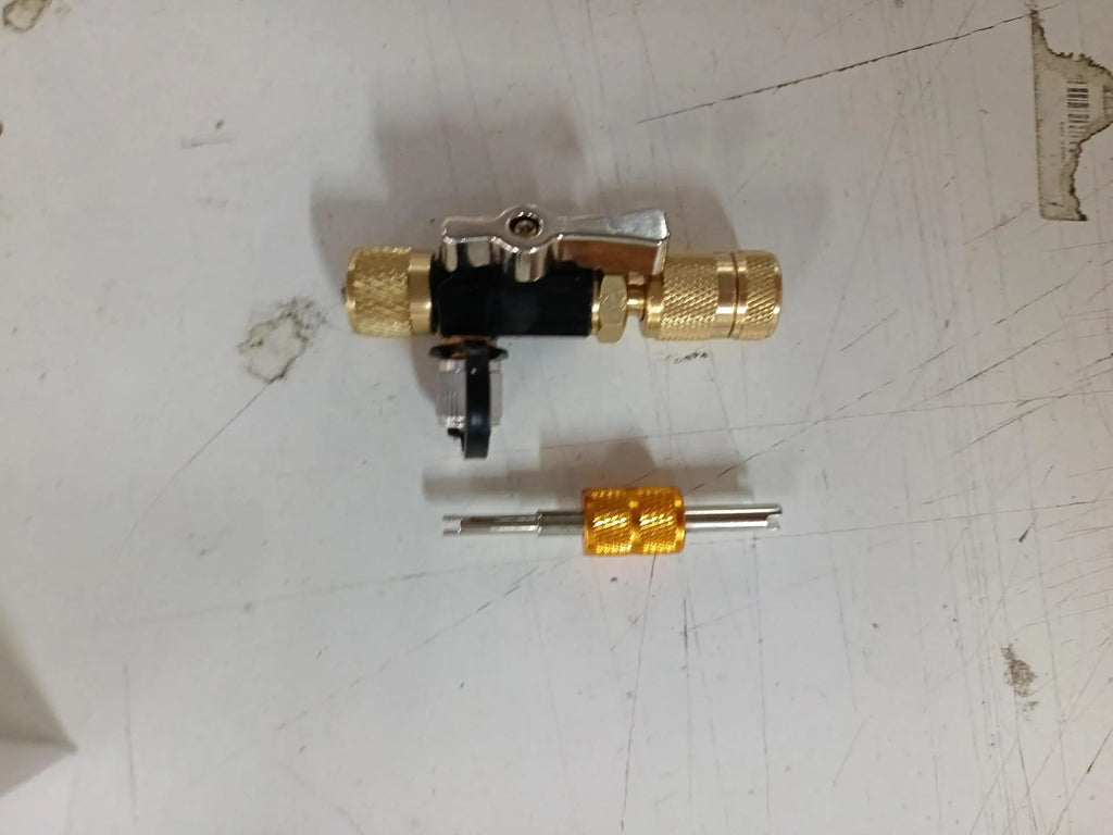 Metal vacuum valve core disassembly tools in 1/4 inch black and 5/16 inch pink sizes
