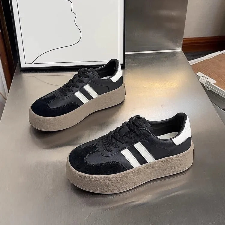 Women's vintage distressed leather sneakers with round toe and lace-up front closure