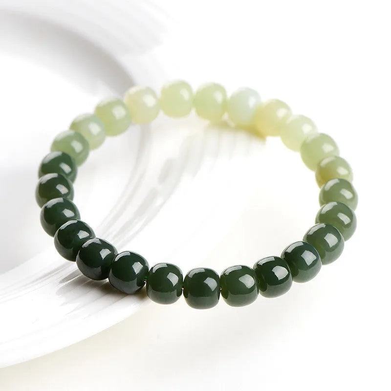 Natural Hetian jade bracelet with water gradient colouring showing polished stones in casual unisex design
