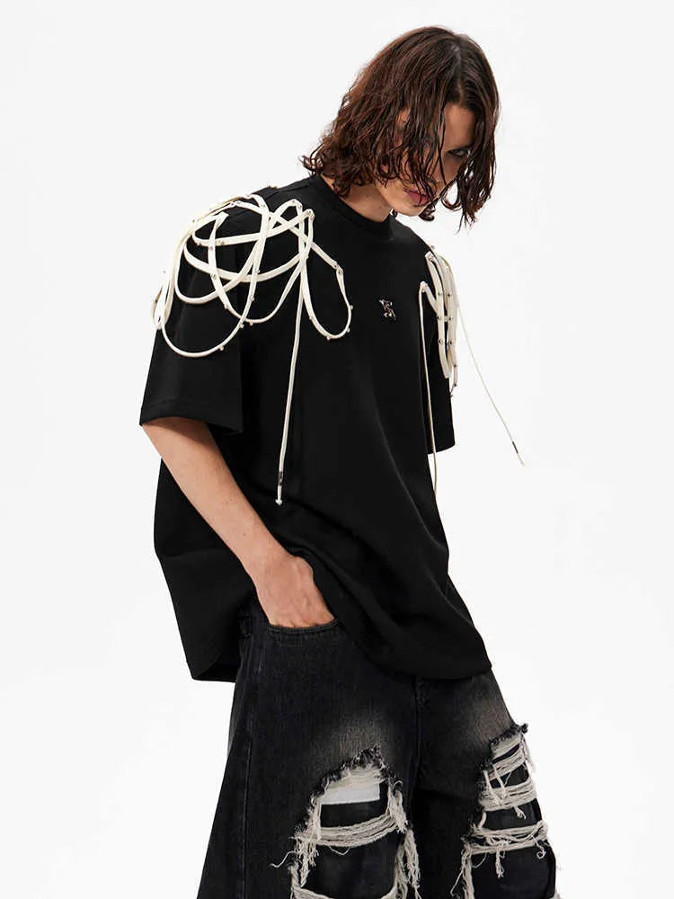 Black women's short-sleeve T-shirt with rivet ribbon detail on padded shoulder.