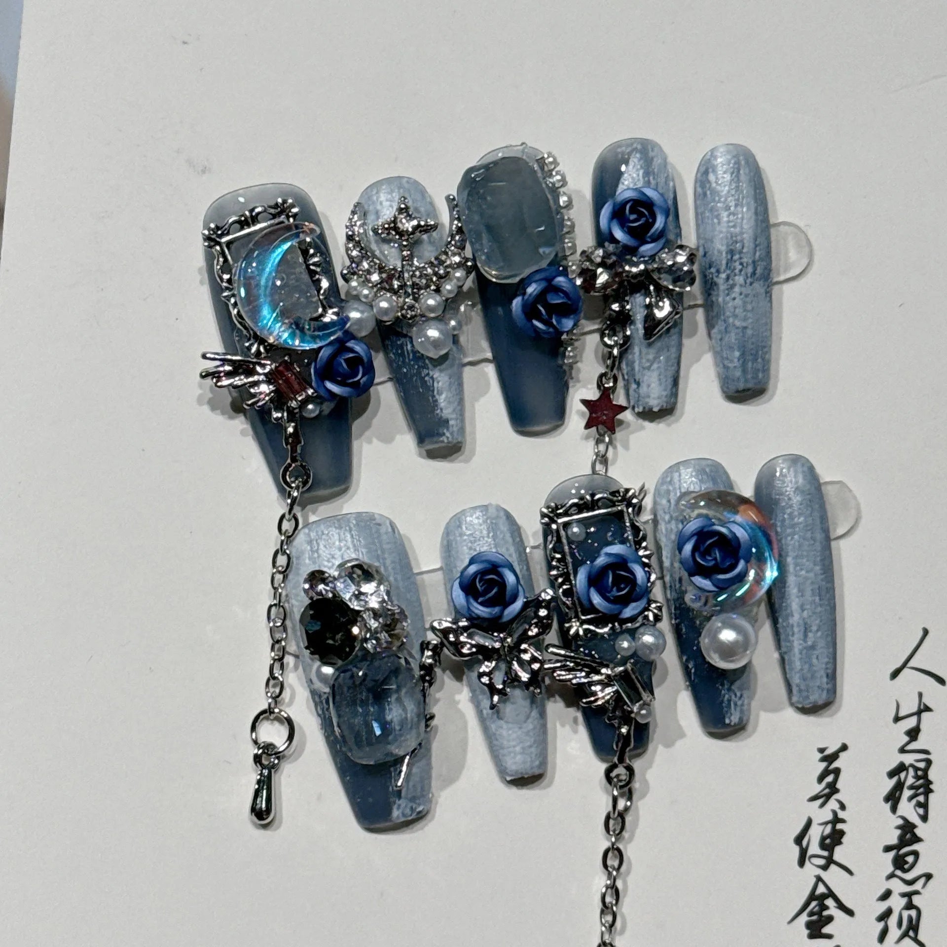 Heavy industry blue nail stickers with twinkling rose and tulip patterns for evening manicures