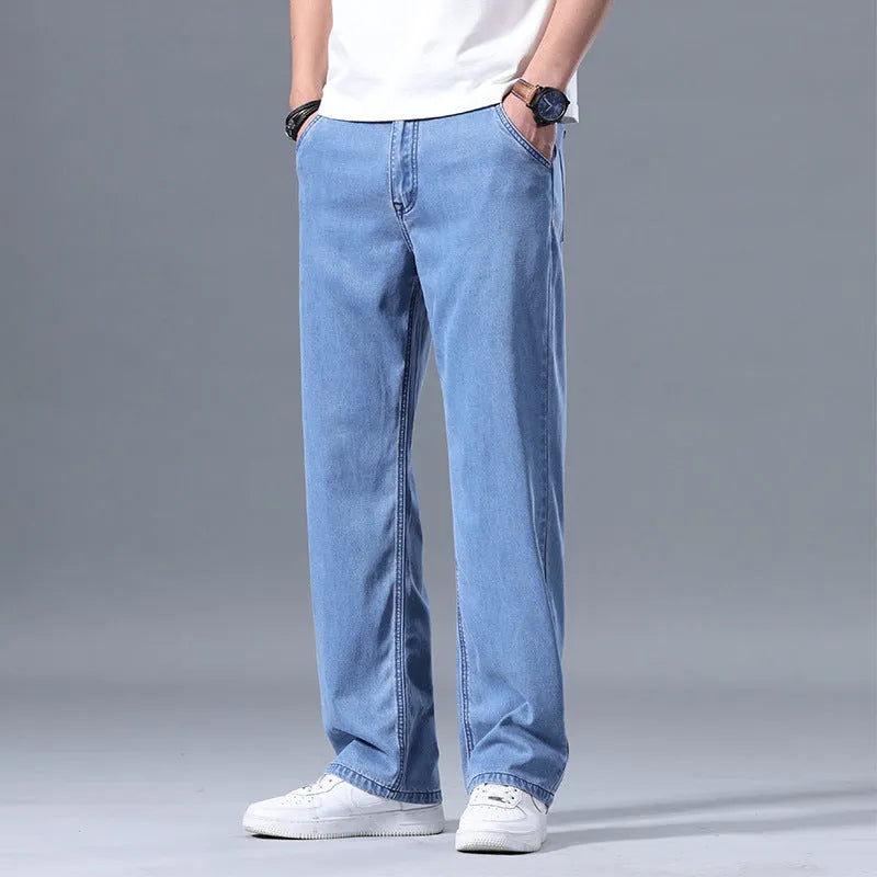 Men's loose straight-leg lyocell jeans in light blue colour showing zipper fly and relaxed fit
