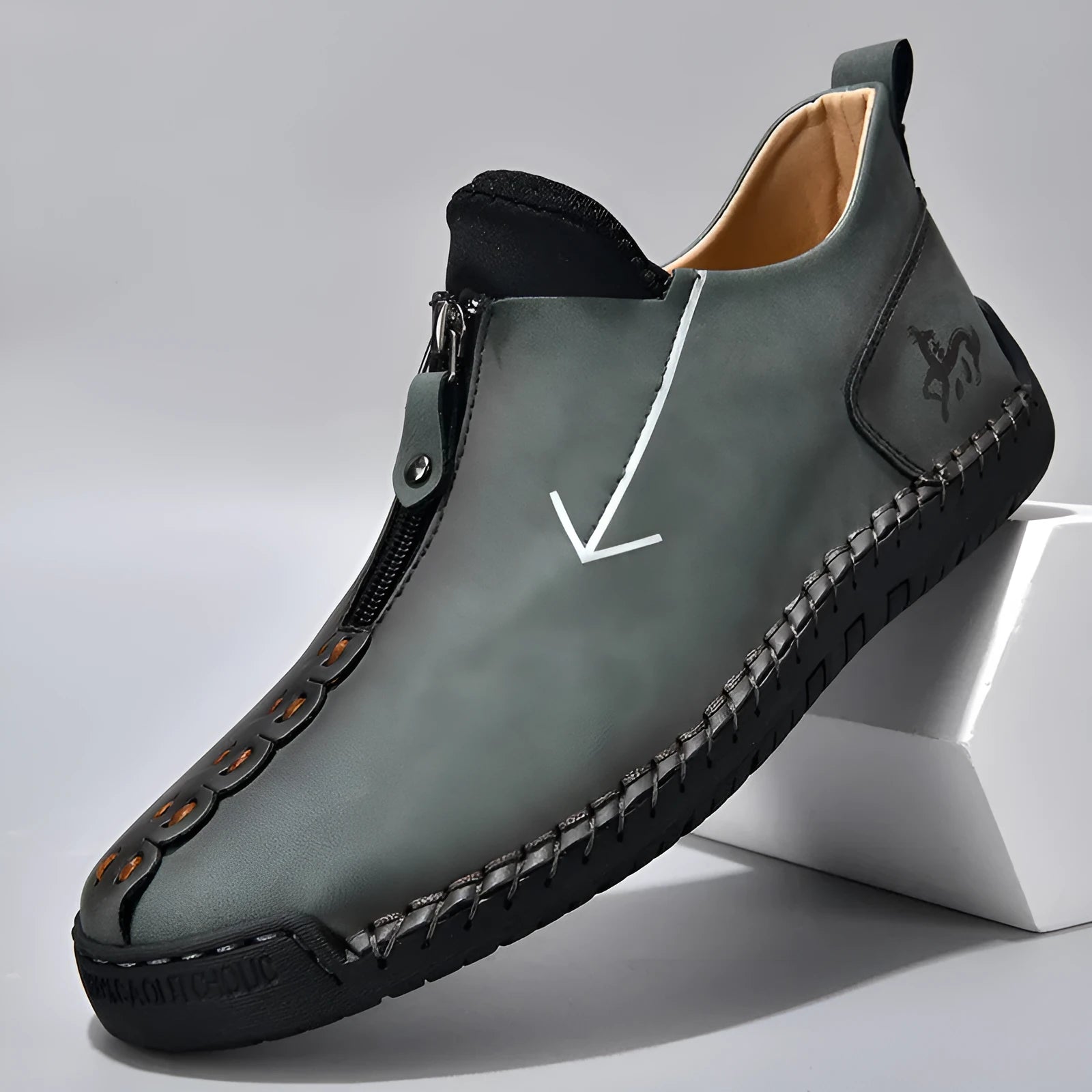 Men's black martin boot with front zipper and round toe on a rubber sole.
