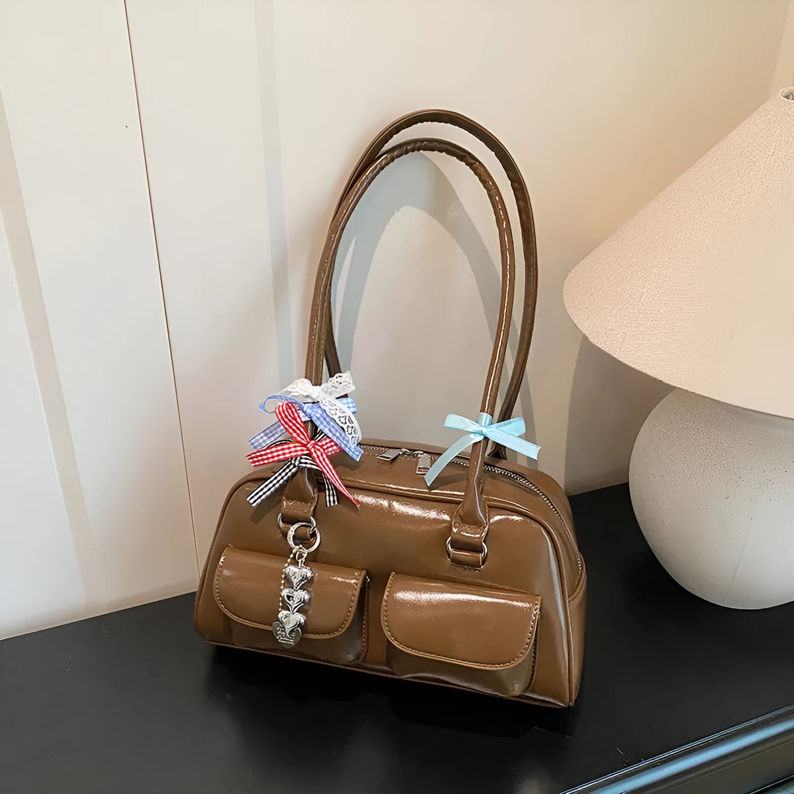 Retro brown PU women's pillow handbag with a flap closure and double shoulder strap.