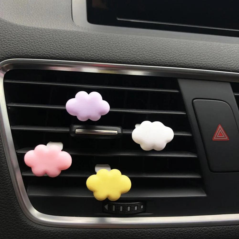 Resin Baiyun cartoon character car air vent fragrance clip in assorted colours.