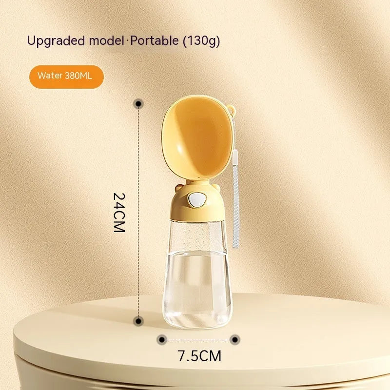 Portable dog water bottle and attached feeding bowl in yellow, pink, or brown for outdoor travel.