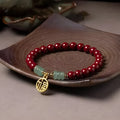 Handcrafted cinnabar bracelet with wave pattern design and copper bead accents in traditional Chinese style