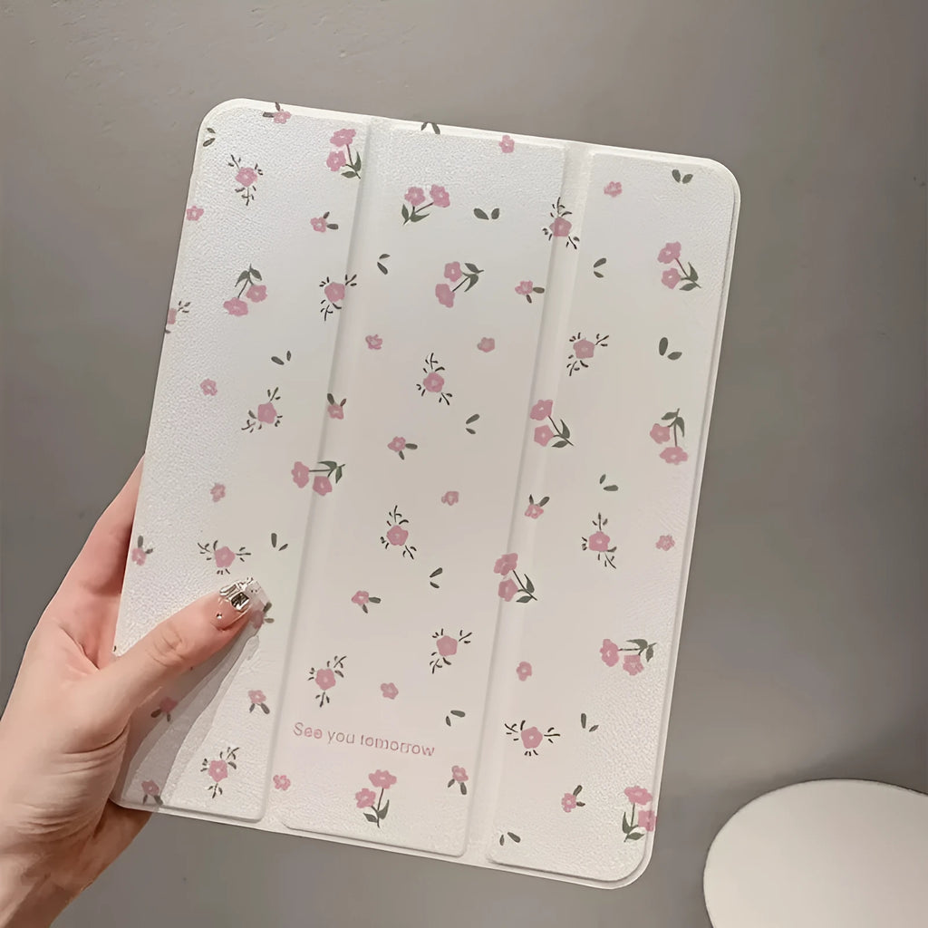 Transparent floral tri-fold iPad protective case showing magnetic stand functionality for Apple tablet models