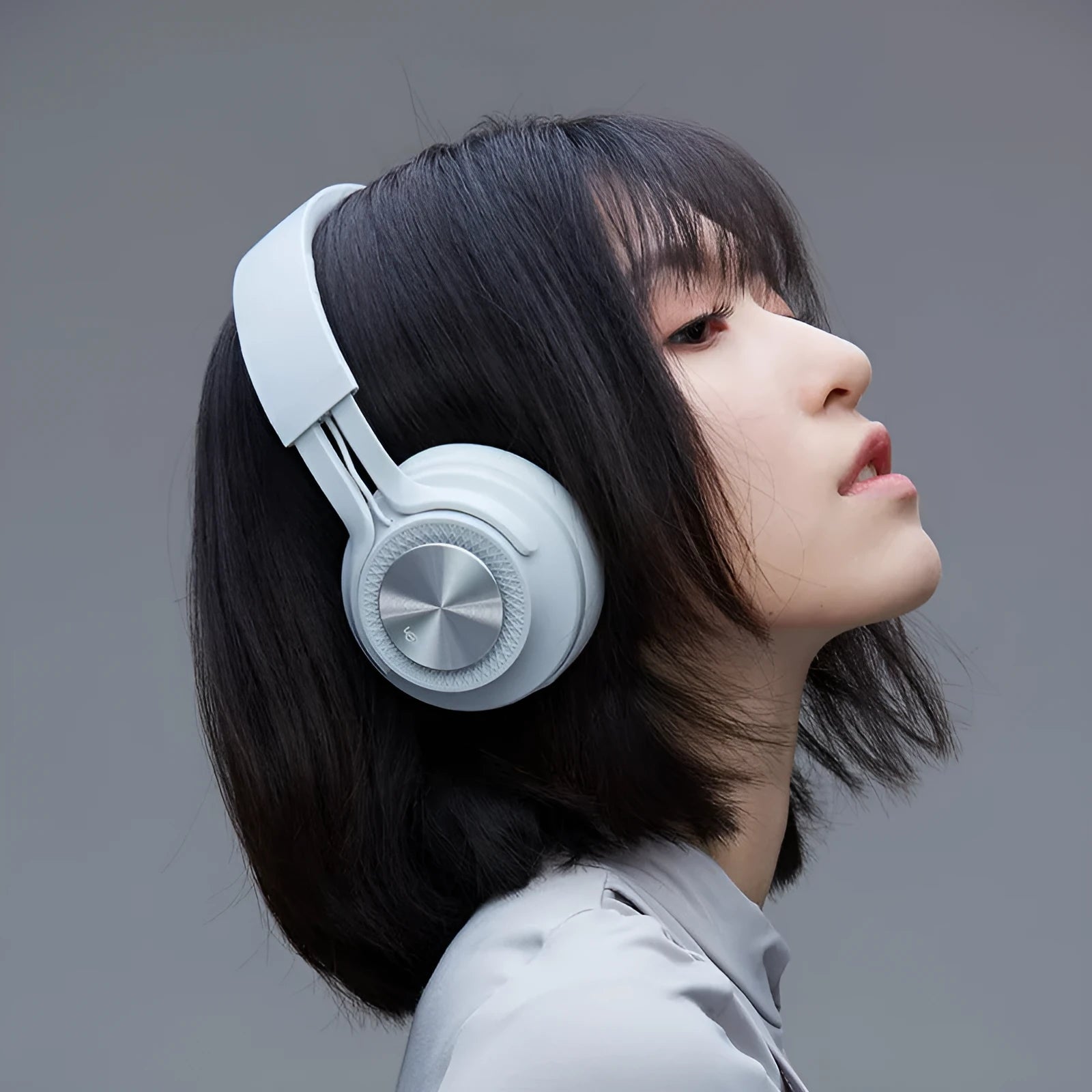 Red sports wireless Bluetooth headset shown from the side.