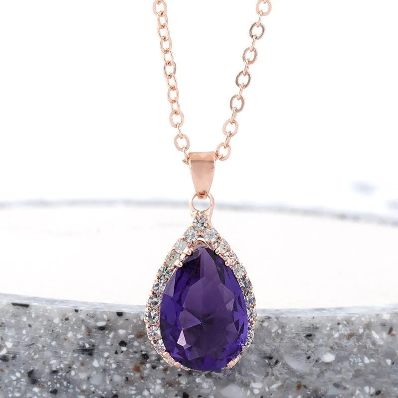Women's rose gold electroplated rhinestone necklace with geometric water drop pendant in pink colour