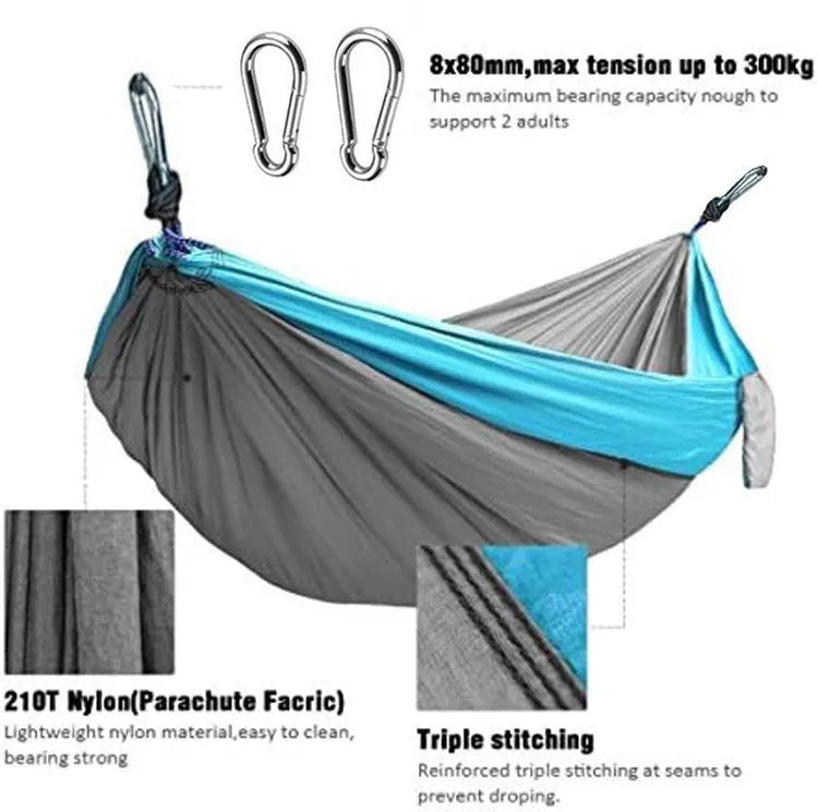 Blue nylon parachute cloth outdoor hammock hanging between trees
