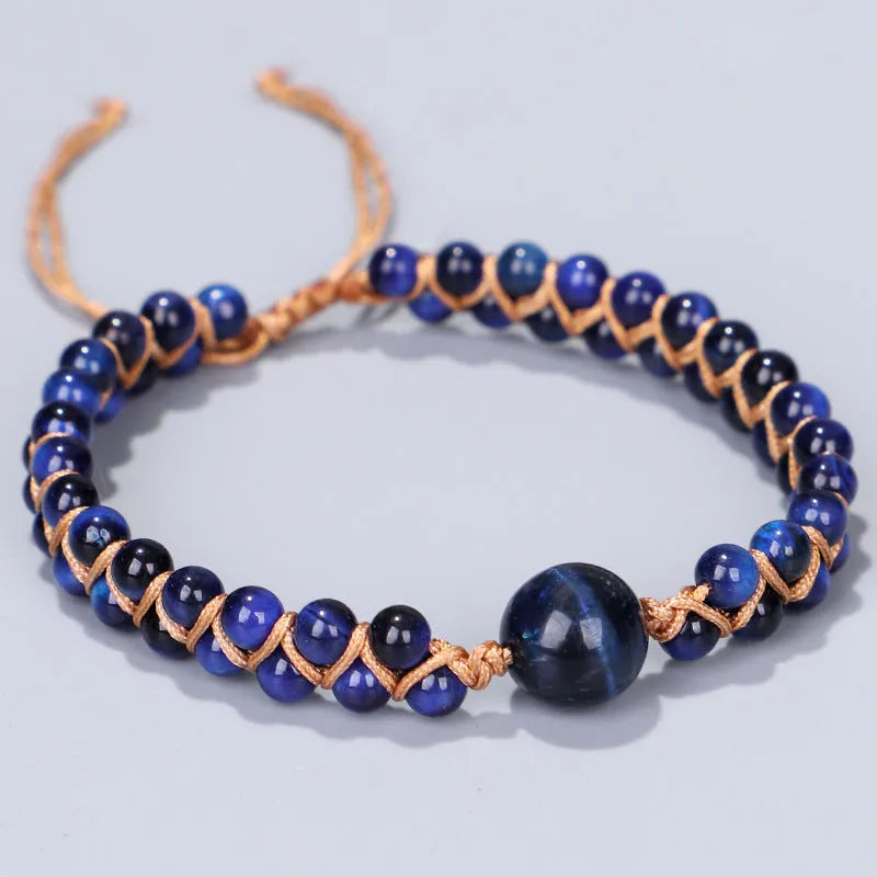 Hand-woven geometric bracelet made from tigereye stone with an adjustable sliding knot, shown in blue colour
