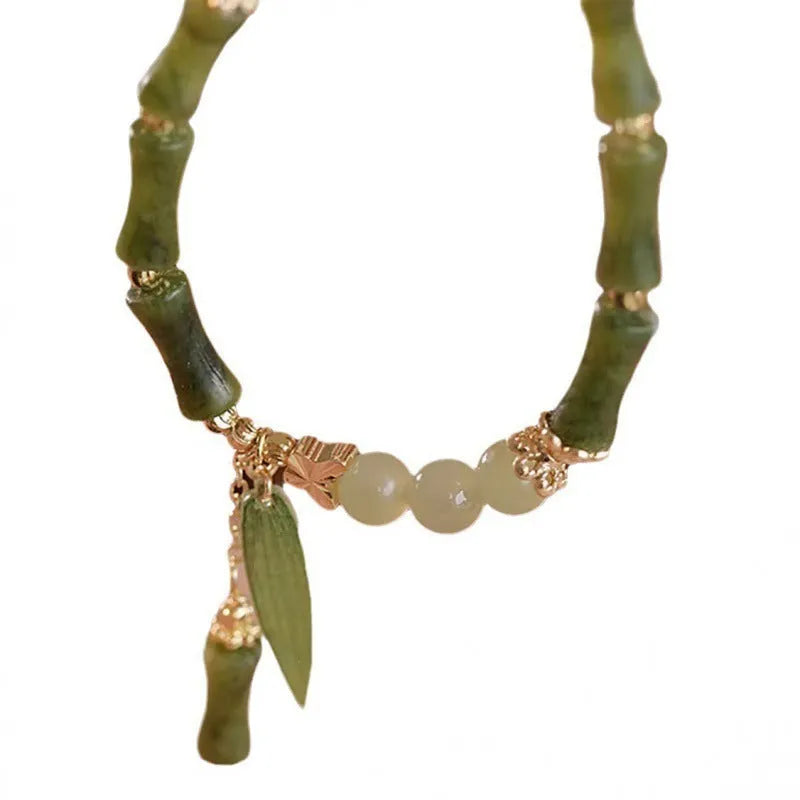 Chinese style glass bracelet with bamboo joint element in multiple colour variations