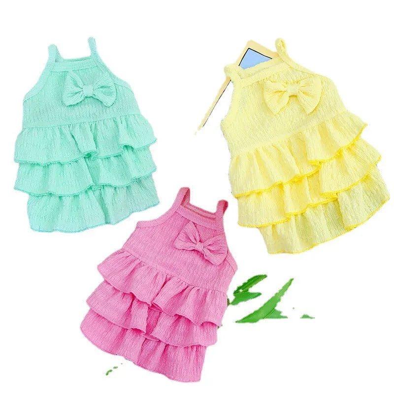 Small dog wearing princess dress with layered skirt design in candy colour option