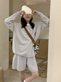 Women's knitted sweater shorts suit with embroidery detail in milk blue colour