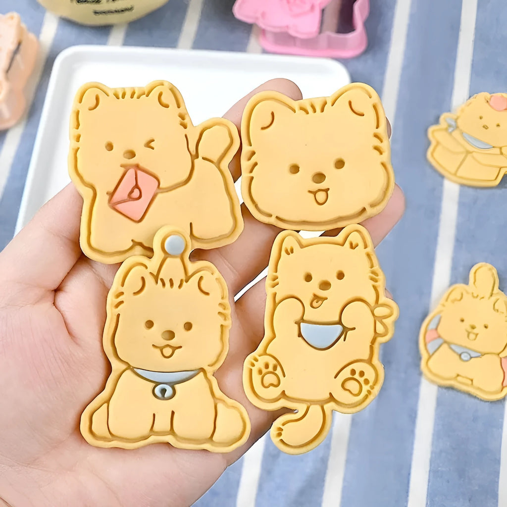 Three dimensional plastic biscuit mold with puppy cartoon designs including puppy head and birthday hat