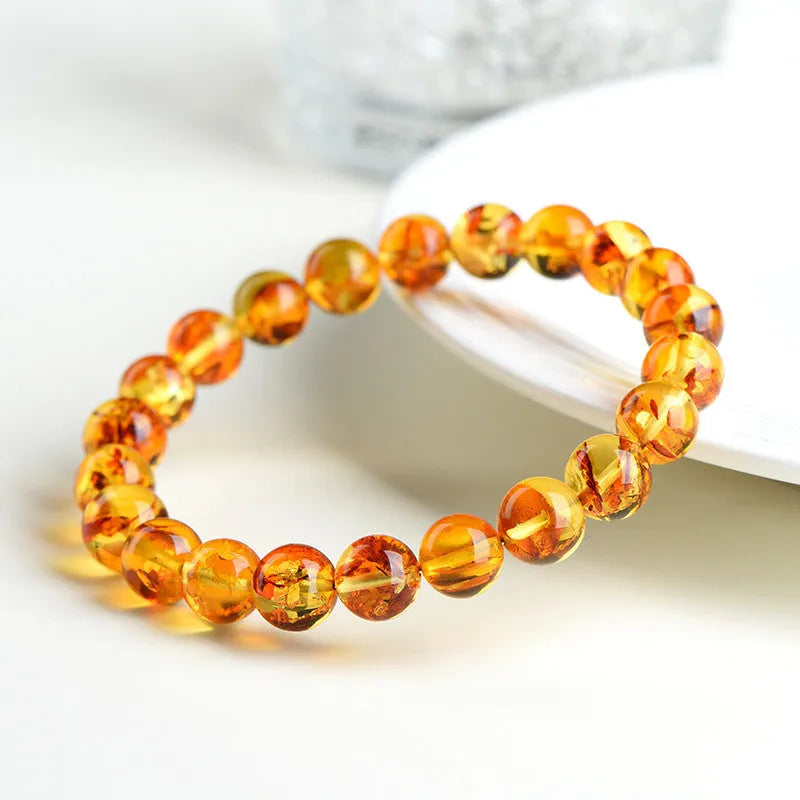 Natural yellow piebald amber bracelet with geometric beads in multiple diameter options