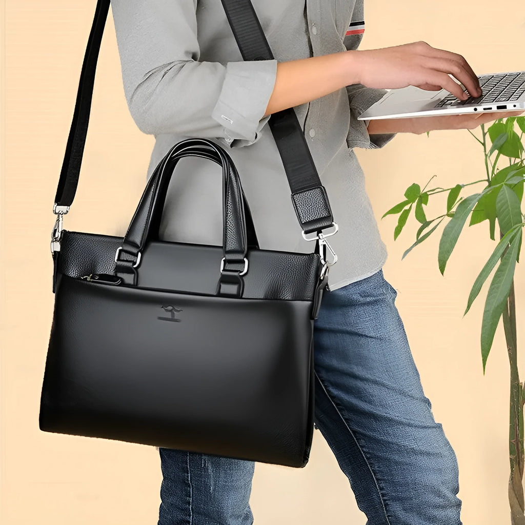 Men's black PU leather business messenger bag with shoulder strap showing spliced panel design.
