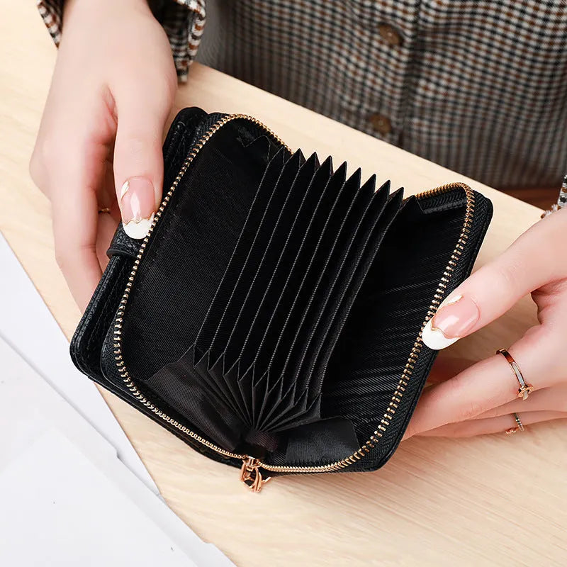 Ladies' short bifold wallet with embossed lychee pattern in PU leather, shown closed.