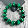Green tiger eye stone bracelet with geometric beads in polished finish