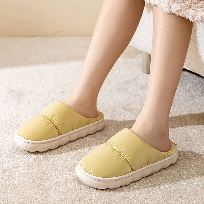 Down cotton slippers with artificial leather upper, rubber sole and plush lining in multiple colours