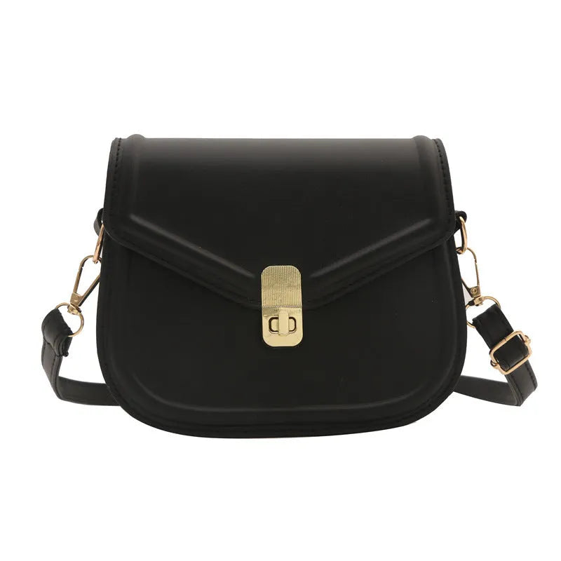 Soft niche texture PU messenger bag in horizontal square clamshell design shown in black colour.