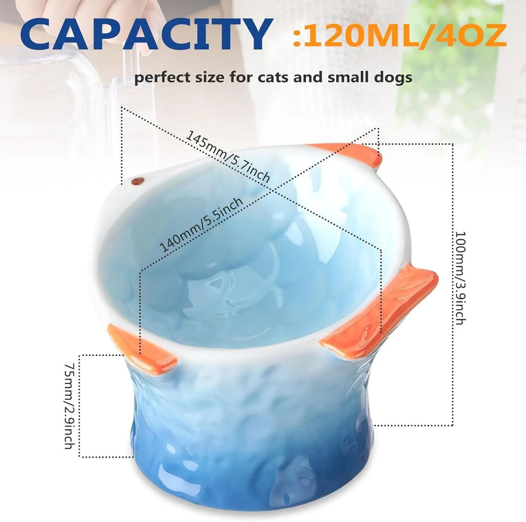 Set of blue, green, pink, and yellow ceramic fish shaped cat bowls with a tilted design.