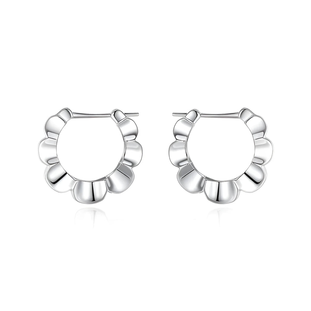 Pair of sterling silver geometric hoop earrings with round retro design elements
