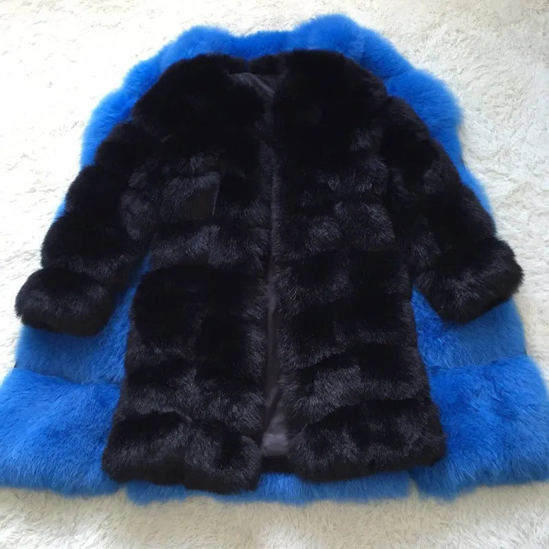 Women's long black artificial fur winter coat with regular sleeves on a hanger.