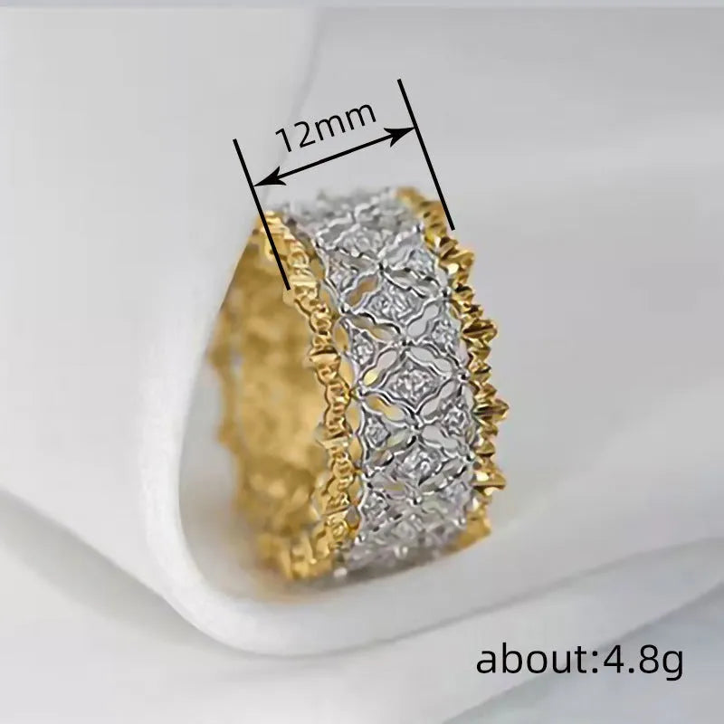Gold two-tone geometric ring with round zircon details on a copper band.