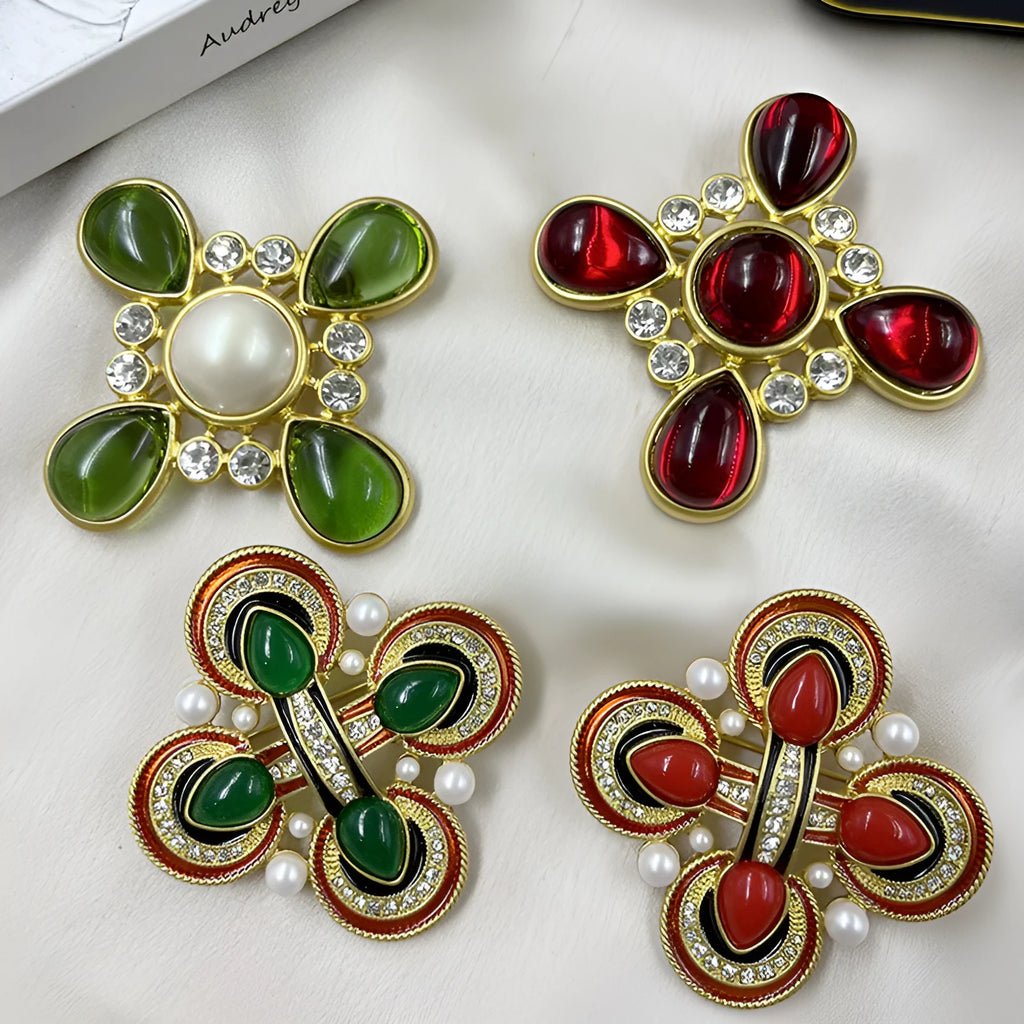 Close-up of a zinc alloy baroque brooch with a central crystal cross in a vintage style.