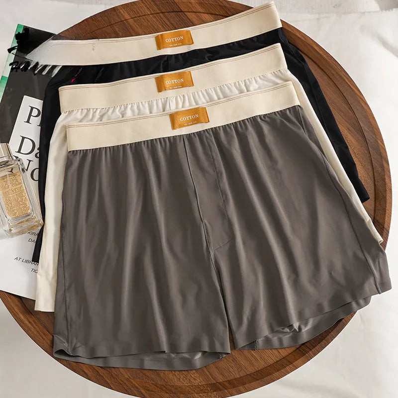 Pack of three men's solid colour ice silk underwear in loose fit mid waist design