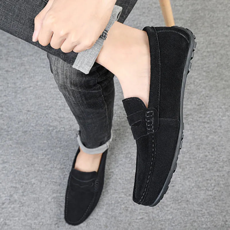 Men's brown suede loafers with round toe and flat rubber sole